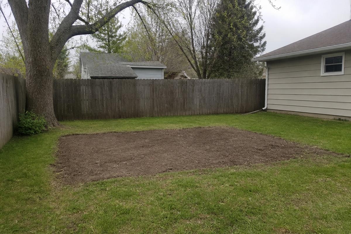Bare raked patch of yard after shed teardown and debris removal in Cherryville, NC